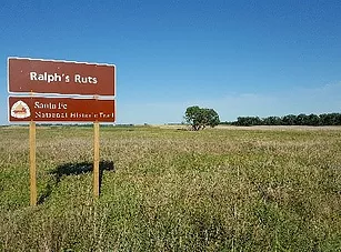 field with sign reading Ralph's rut